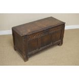 An 18th Century oak Coffer with moulded hinged top and carved panelled front, 3ft 10in W