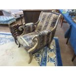 A Regency style decorated Armchair, the scrolled back and downswept arms above a deep seat raised on