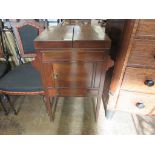 A George III mahogany Gentleman's Dressing Table, the square top opening to reveal a fitted interior