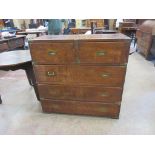 A mid 19th Century Campaign Chest of drawers, the brass bound top above two short and one long