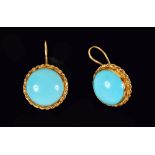 A pair of Persian Turquoise Earrings each set large round cabochon in rope twist frames in 18ct