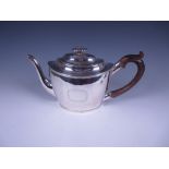 A George III silver oval Teapot engraved initial S within floral cartouche, pearwood handle,