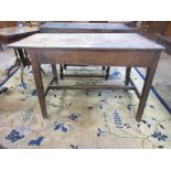 A small antique oak Farmhouse Table with pegged three plank top on square legs united by H