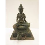 A large Thai bronze Figure of Tara, seated on a lotus base with foot resting on a lotus, 36in H, A/