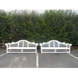 A pair of white painted Garden Benches with slatted arched backs and scrolled arms, 8ft 6in W