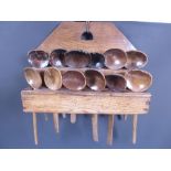 An antique two tier Spoon Rack and a Collection of twelve early treen Spoons