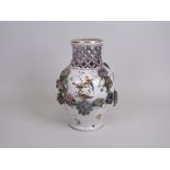 A Berlin Vase with lattice pierced rim and floral encrusted decoration, painted with birds,