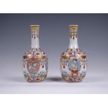 A pair of Chinese famille rose porcelain 'Baragon Tumed' bottle Vases, 20th Century, decorated