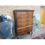 An 18th Century crossbanded walnut Chest on Stand, the moulded cornice above two short and three