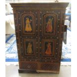 A decorative Indian painted Cabinet with pair of arched two panel doors above two short drawers