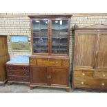 An 18th Century mahogany Library Bookcase, the dentil moulded cornice above a pair of glazed doors