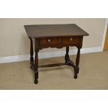 An antique oak Side Table fitted two short drawers above shaped frieze on baluster turned and square