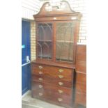 A George III mahogany Secretaire Bookcase with swan neck surmount above pair of arched glazed doors,