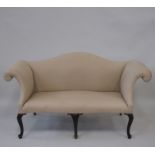 A George III style mahogany Sofa, the padded serpentine top and overscrolled arms on carved cabriole