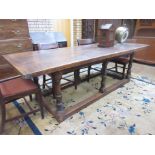 An antique oak Refectory Table in the 17th Century style with cleated five plank top on six turned