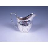 A George III silver oval Milk Jug with engraved frieze, reeded rim, London 1808, maker: Bateman