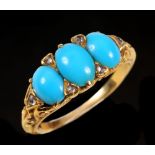A Turquoise three stone Ring claw-set graduated oval cabochons with rose-cut diamond points