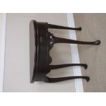 A Georgian mahogany demi-lune Tea Table with shaped apron on four cabriole legs and hoof feet, 2ft