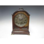 A George III mahogany cased Bracket Clock with circular silvered dial inscribed J Bell, London, with