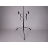 An early iron double Candle Holder on turned column and tripod base, 3ft 4in