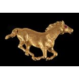 An 18ct gold galloping Horse Brooch with ruby cabochon eye, approx 6.50gms