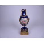 A Sevres style porcelain Vase with reserves of romantic figures in landscape, moulded gilt swags,
