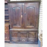 An 18th Century oak Hall Cupboard with pair of fielded panelled doors above three plain square