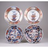 Two pairs of Japanese Imari Dishes, Meiji Period, painted with a landscape within a foliate