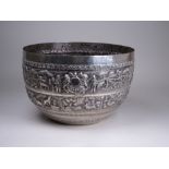 A large Indian white metal Bowl, Lucknow, embossed with two registers of continuous scenes depicting