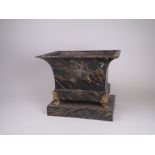 A painted toleware Planter of classical form with flared rim on gilt paw supports standing on a