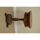 A 19th Century rosewood Teapoy of circular form with hinged top on turned column and circular base