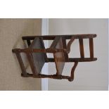 An 18th Century ash Child's Highchair, possibly Scottish, with shaped arms, turned supports and foot