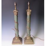 A pair of Regency style green glazed Table Lamps of corinthian column form with trailing brass