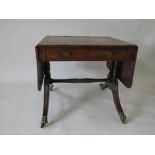 A Regency mahogany and rosewood crossbanded Sofa Table, each side with one short and one dummy