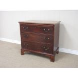 A Georgian mahogany Chest of Drawers fitted brushing slide and three graduated drawers, raised on