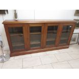A 19th Century mahogany and glazed four door Bookcase with adjustable shelves on plinth base, 6ft