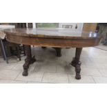 A 19th Century rosewood oval Centre Table fitted two frieze drawers on two tapering columns and four