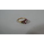 A 9ct Gold Ladies Dress Ring with Red Stones