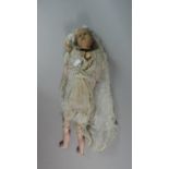 A 19th Century Doll in Need of Restoration with Closed Mouth and Opening Eyes