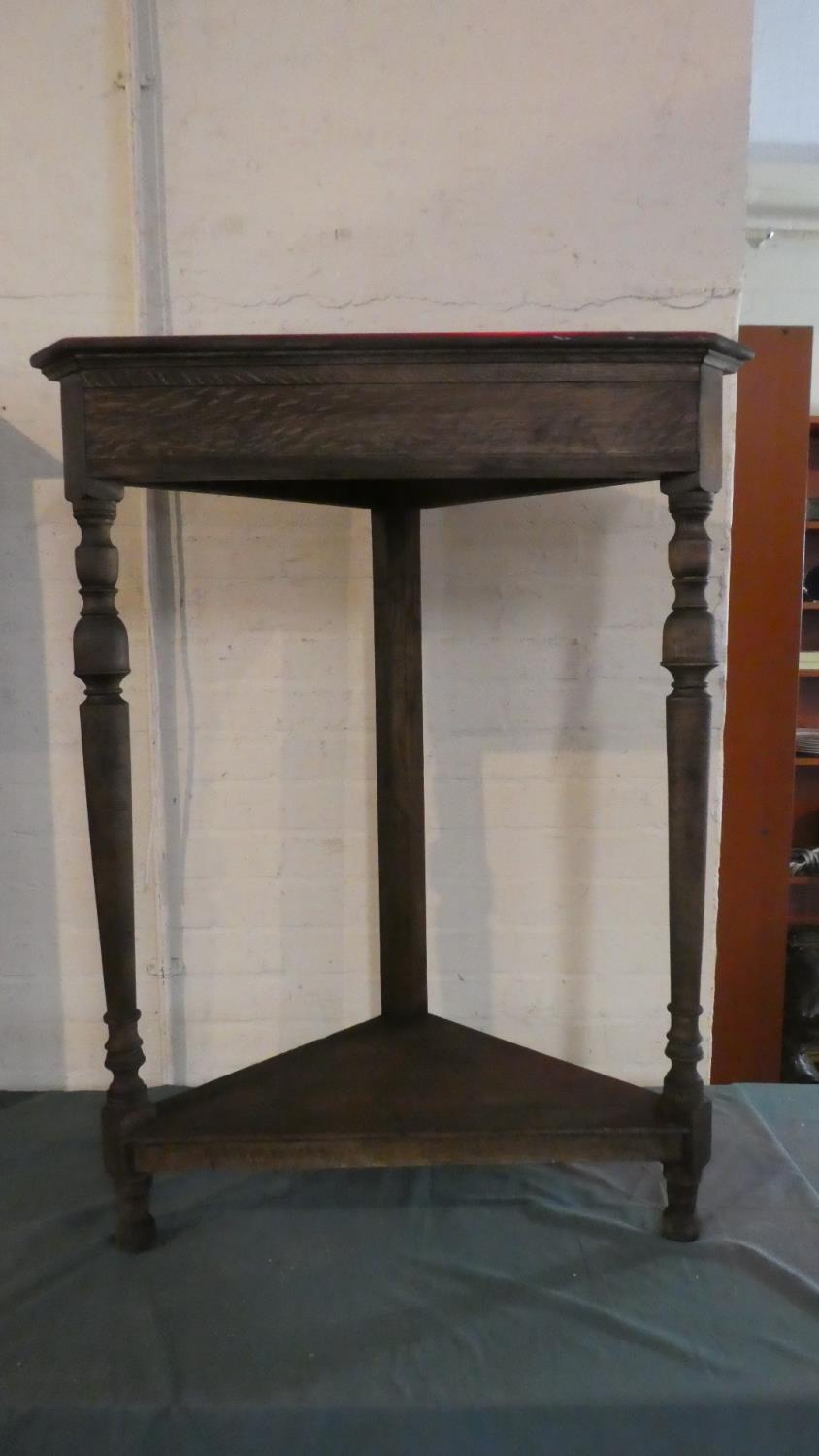 A Late 19th Century Oak Corner Stand with Turned Supports and Stretcher Shelf, 81cm Wide and 102cm