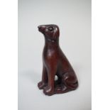 A Carved Wooden Netsuke of a Hound, 7.5cm High