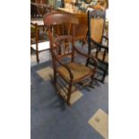 A Scumble Glazed Cane Seated Spindle Back Rocking Chair