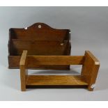 An Edwardian Oak Stationery Rack and a Book Trough