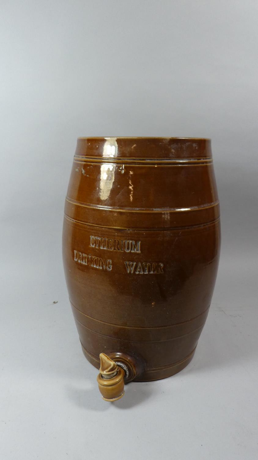 A Treacle Glazed Stoneware Barrel. 'Etherium Drinking Water' with Ceramic Tap, 4 Gallon, 43cm High