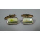 A Pair of Gold Painted Cufflinks Decorated with Enamelled Steamer Ship
