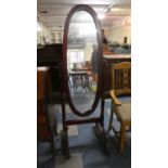 A Mahogany Cheval Mirror with Oval Glass