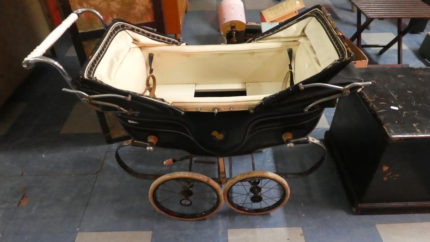 A Vintage Silver Cross Dolls Pram