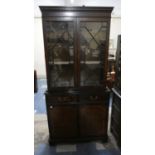 A Mahogany Astragal Glazed Bookcase with Two Centre Drawers with Cupboard Base, 91cm Wide