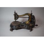 A Vintage Gilt Decorated Sewing Machine