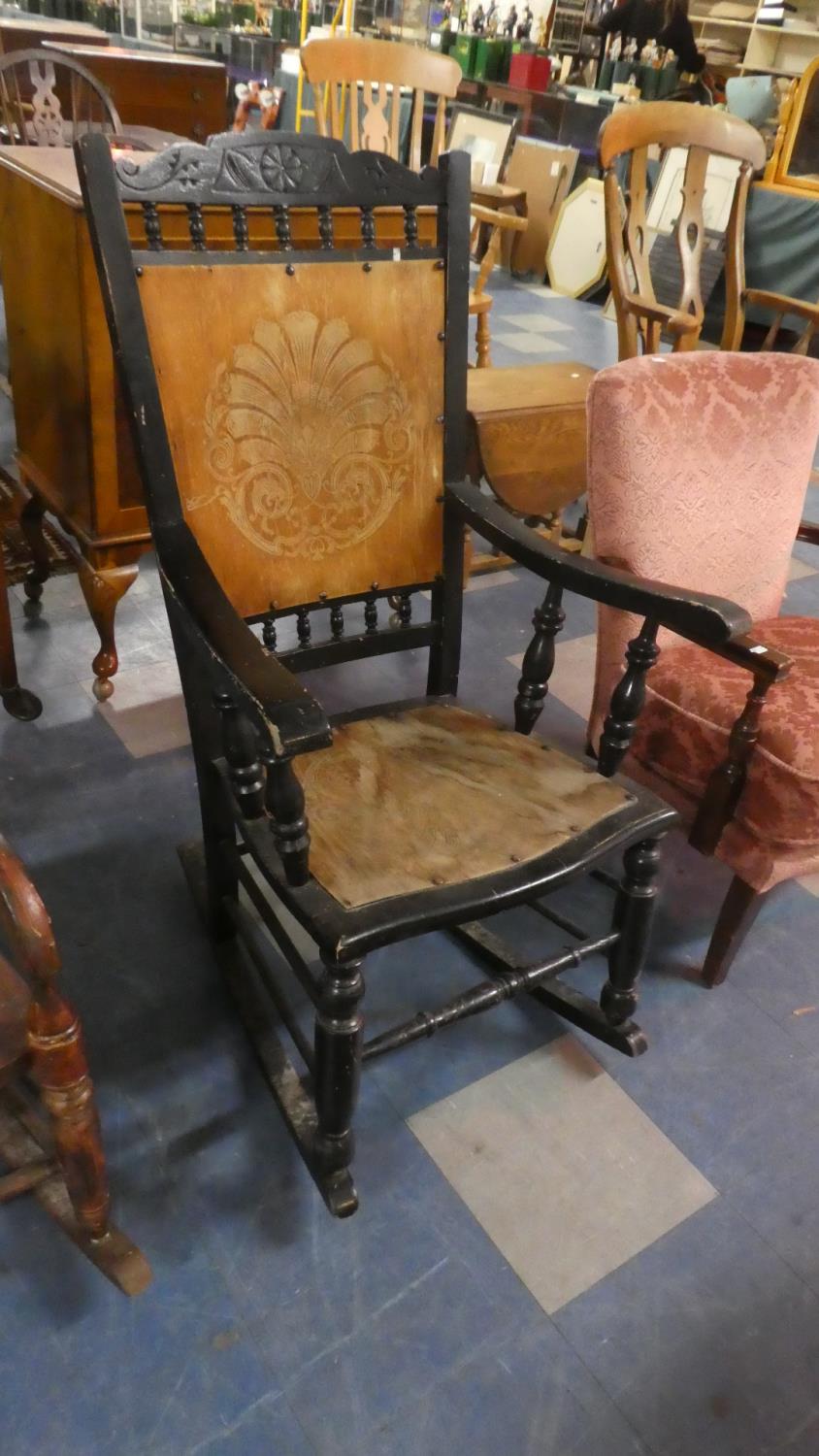 A Late Victorian Ebonised Framed Rocking Chair